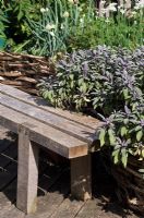 Wooden bench in organic edible roof garden -Reading International Solidarity Centre