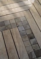 Close up of decking with inset squares of wood as detail - Wilton Place, London