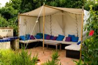 Tented sitting area in Moroccan theme garden