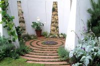 Chic Garden - Crushed red stone spiral with slate mound in centre 