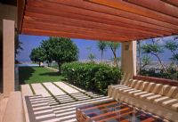 Contemporary seating area beneath pergola