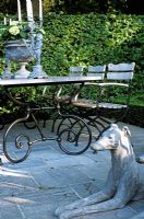 Terrace with dog sculpture and furniture 