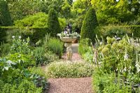 Formal garden with central stone ornament