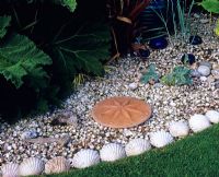 Seaside garden edging with shells