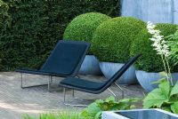 Garden chairs and topiary Buxus balls in zinc containers - The Laurent Perrier Garden - Winner of Gold Medal and Best Show Garden RHS Chelsea Flower Show 2008