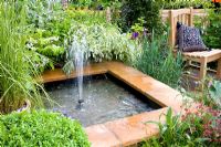 Pond with fountain - Garden - Real Life by Brett, Design - Geoffrey Whiten, Sponsor - Brett Landscaping and Building Products - RHS Chelsea Flower Show 2008
 