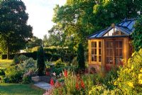 Summerhouse amongst conifers and Penstemon - Cedar Farm, Desborough, Northants