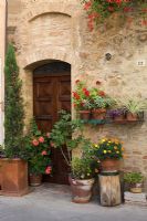 Assorted pots outside a house in Tuscany - Italy