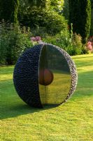 The Kernel sculpture on a lawn at dawn - Pettifers Garden, Oxfordshire
