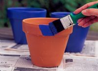 Painting terracota pot with blue paint