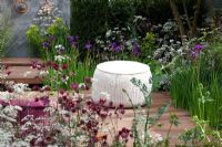 Naturalistic planting to attract a diverse range of insects surround a timber seating area, planting includes Acer campestre, Taxus baccata, Cirsium rivulare, Anthriscus sylvestris 'Ravenswing', Iris germanica, Euphorbia palustris, Digitalis, Deschampsia caespitosa and Aquilegia 'Ruby Port' - Nature Ascending Garden - Gold medal winner for Urban Garden at RHS Chelsea Flower Show 2009  