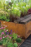 Raised border and seating area made with rusted metal and timber - The Future Nature Garden, Sponsored by Yorkshire Water, University of Sheffield Alumni Fund, Green City Initiative, Buro Happold - RHS Chelsea Flower Show 2009 
