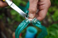 Garden watering system - Step 6 - Use soft wire to secure the seep hose to the copper fitting
