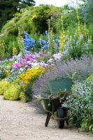 Weeding the herbaceous border at Waterperry gardens, Oxfordshire