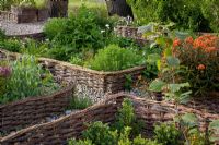 Potager garden with woven edges around the beds - Brampton Willows