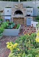 Wood burning stove in Outdoor cooking area with raised organic vegetable beds, Hampton Court Flower Show
