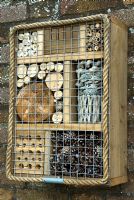Insect box with a variation of chambers and materials to attract a wide range of insects