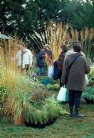 Group of visitors attending Courson. French garden plant festival. Journee des Plantes du Printemps.