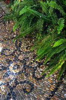 Mosaic pebble paving with ferns