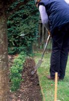 Trimming and tidying lawn edge 