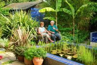 Frances and Andrew Franklin sitting in their garden.