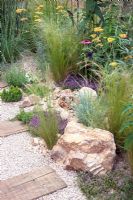 Crushed recycled ceramic gravel path, plantings of Achillea 'Terracotta', Stipa arundinacea, Echinacea purpurea, Rosmarinus officinalis and Thyme - 'The Firepit Garden', Silver Medal Winner at the RHS Hampton Court Flower Show 2010 
