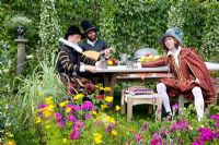 Actors in costume in the 'The Taming of the Shrew' garden - Silver Medal winner - RHS Hampton Court Flower Show 2010 