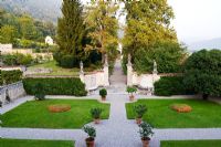 View from Villa onto Parterre and view of the Secret Garden - Villa Della Porta Bozzolo, Casalzuigno, Italy 