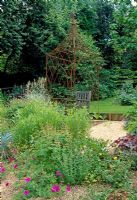 Rusted Gazebo and bench in gravel garden, Barleywood, Hants.