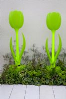 Neon flower shaped ornaments. Chic Tranquillity garden - RHS Tatton Park 2010