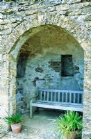 Seat in Alcove in stone wall. Mappercombe Manor garden, Dorset.