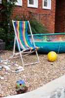 Seaside themed garden with colourful deckchair and boat - Palatine Primary School, Worthing

