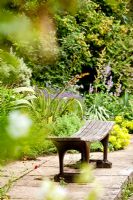 Bench in Lower garden - Kiftsgate Court Garden, Chipping Campden, Gloucestershire, UK