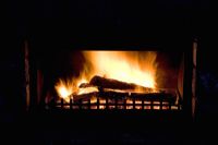 Wood-burning open fireplace. New Zealand