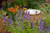 Water feature and Agastache 'Blue fortune', Eragrostis curvula - African Love Grass, Helenium 'Waldtraut'. Painting with Plants' garden - Silver Gilt Medal winner, RHS Flower Show Tatton Park, Cheshire 2011 
