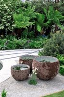 Decorative clay pots containing miniature water gardens 