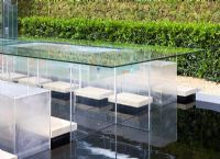 Glass table and seating area with pool below - 'The B and Q Garden', Gold Medal Winner, RHS Chelsea Flower Show 2011 