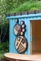 Turquoise painted garden office with 'living roof' made from a refurbished shipping container - 'The Royal Bank of Canada with the RBC New Wild Garden' - Silver Gilt Medal Winner, RHS Chelsea Flower Show 2011 
