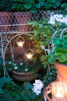 Hanging tealights and Geraniums in container