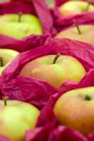 Apples stored for winter by wrapping in red tissue paper