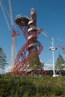 Olympic Park Sculpture by Anish Kapoor - the Arcelor Mittal Orbit, nicknamed the Helter-Skelter and the Hubble Bubble with giant cranes and North American Prairie planting. 