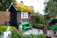 Garden potting shed with living roof and weather vane  - 'The Home Front Garden', Bronze Medal Winner, RHS Hampton Court Flower Show 2011 
 