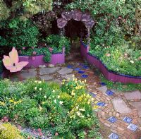 Butterfly bench, yellow tulips and a copper 'Morning Glory' arch - San Francisco