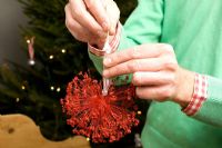 Making homemade Christmas tree decorations with sprayed seedheads