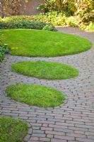 Paving and shaped lawn