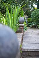 Path at top of steps with ball finials