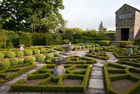 The Fancy Garden includes a gazebo, from which to gaze upon the garden, and a pattern made from box based on a Tudor rose pattern - Herterton House, Hartington, Northumberland, UK