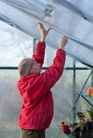 Insulating a greenhouse to protect young plants