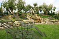 Mediterranean style garden with ancient olive trees, French lavender, water cascade over rocks and drought resistent planting. A Little Bit of Home. Villaggio Verde and Alchemy Gardens. Malvern Spring Show 2012. Silver- Gilt Medal. 