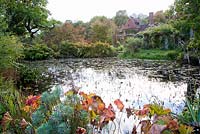 View of 16th Century house across the pond, forming part of Gertrude Jekyll's Water Garden - Vann, Surrey